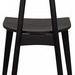 Back of Kimi Chair showcasing curved backrest with visible wood grain and angled legs
