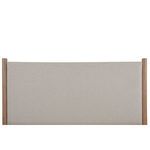 Detailed front view of rectangular beige upholstered headboard flanked by rubberwood posts