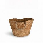 Close-up of basket showing woven texture and one handle facing forward