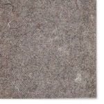 Detailed close-up of the pad's needle-punched fabric surface showing fiber texture and color variation
