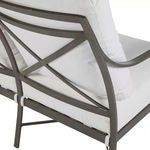Close-up of X-frame aluminum backrest with white cushion details.