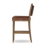Side view of Bella Bar + Counter Stool highlighting seat thickness and walnut legs