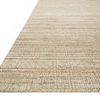 Jamie Natural Sand Rug at an angle showing flat woven texture and thin beige stripes in warm tones