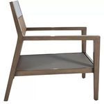 Side view of chair without cushions revealing raffia back panel and seat frame