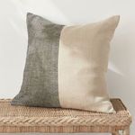 Jules Pillow styled on woven rattan bench with natural light and shadows