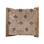 Top-down view of seat's reverse side showing muted pinkish-beige weave with diamond pattern