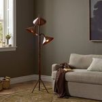 Asten Floor Lamp next to a beige sofa in a living room setting with neutral decor.
