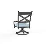 Rear angle highlighting X-back frame and swivel base of the chair