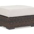 Montecito Ottoman with Cognac multi-colored woven resin wicker base and thick white outdoor cushion