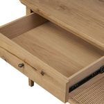 Interior view of open nightstand drawer showing light oak finish inside