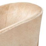 Close-up of upper backrest and top edge seam with soft, dense buff hair on hide texture