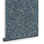 Rolled wallpaper showing Salix Leaves pattern with visible texture and soft edges