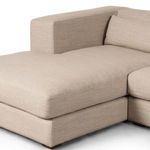 Close-up of chaise cushion showing plush padding and fabric weave detail