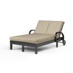 Front angle showing sunlight reflection on espresso aluminum frame and beige cushions of Monterey Double Chaise