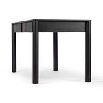 Side back angle showing desk’s rounded legs and drawer panels