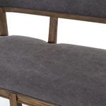Detailed close-up of canvas upholstery texture and seam stitching on seat
