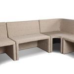 Side corner angle highlighting rattan texture and soft fabric cushions