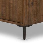 Close-up of tapered black gunmetal iron leg supporting the Wyeth Sideboard.