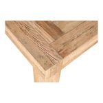 Close-up of reclaimed oak table corner highlighting wood texture and joinery details