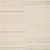 Soft sage rug with a subtle multi-tonal striped pattern in a natural wool texture
