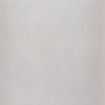 Close-up of matte white cylindrical base highlighting minimal texture and organic imperfections