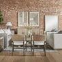 Living room scene showing Siena sofa with woven dining chairs replacing armchairs