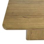 Close-up of table’s rounded corner and wood grain texture on tabletop surface