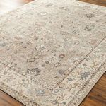 Close-up angled view revealing medium pile texture and intricate floral details of the Davina woven rug