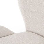 Macro detail of the chair's seat and backrest junction showing upholstery texture and curves