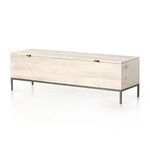 Side angle of trunk showing dovetail joinery, metal legs, and leather pulls