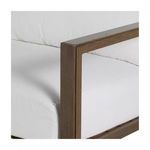 Close-up of sofa arm showing wood grain aluminum frame with white cushions