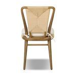 Back view of Greylin Dining Chair showcasing geometric woven backrest and tied cushion strings