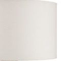 Close-up detail of off-white fabric lampshade texture and woven finial atop braided water hyacinth base
