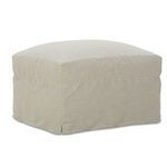 3/4 perspective of ottoman showing plush top and clean tailored skirt in light beige fabric