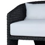 Side rear quarter of chair showing curvature of back and three-leg design