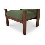 Close-up focusing on wood leg and lower seat cushion corner