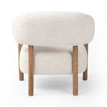 Rear view showing the solid oak frame supports beneath the bulky ivory upholstery