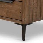 Close-up view of gunmetal-finished drawer handles with minimalist flat design