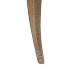 Close-up of tapered chair leg displaying wood grain texture and curve