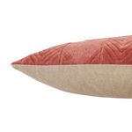 Alternate side view of pillow showing texture contrast between pink embroidered front and beige back