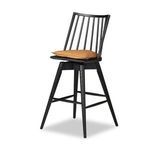 Side angle highlighting the swivel mechanism and backrest attached to seat