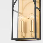 Black frame variation with two exposed bulbs inside gold background and clear glass