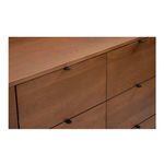 Close-up of top drawers with small black pulls and visible oak wood grain