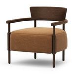 Three-quarter angle showing U-shaped arm rails wrapping around rounded ochre cushion