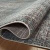 Partial curl showing the underside plaid pattern and tight edge binding of the Ember Denim Charcoal rug