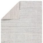 Folded back corner view showing contrast between front subtle stripes and solid woven back