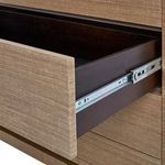 Partially open drawer showing smooth dark interior and metal sliding mechanism