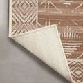 Backside corner flipped over to show durable woven backing in light neutral color