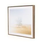 Angled side view focusing on walnut wood frame with natural finish against white background