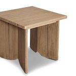 Angled view emphasizing the depth and geometric shape of table sides